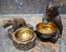 An early 20th century Black Forest table vesta, the bears seated, with brass dish, dished brass