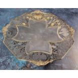 A silver octagonal sweetmeat dish, raised on four curved feet, pierced foliate border, four