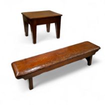 A 19th century long low bench stool, trestle base, 18cm high,  71cm long;   a mahogany stool, 19cm