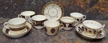 A Newhall teacup and saucer, banded in cobalt blue, picked out in gilt, c,1800; similar teacups,