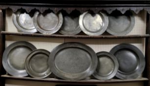Ten 18th century pewter plates, various sizes including meat plate, table plates and seven smaller