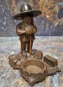 A 19th century Black Forest desk tidy, as a dwarf standing by a well, 17cm high, c.1880