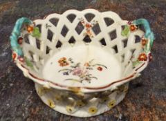 A Derby two-handled flared basket, pierced diaper sides, painted with stylised flowers, double