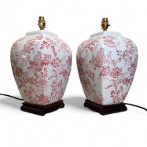 A pair of 20th century panelled side lamps, printed in red with blossoming branches, 38cm high