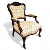 A Louis XV walnut armchair, carved and pierced cresting rail above medallion back rest flanked by