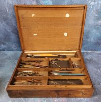 An early 20th century mahognay draughtsman’s drawing instruments box, the interior with pens,