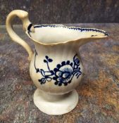 A Liverpool John & Jane Pennington cream jug, of pedestal ribbed form, painted with scrolling