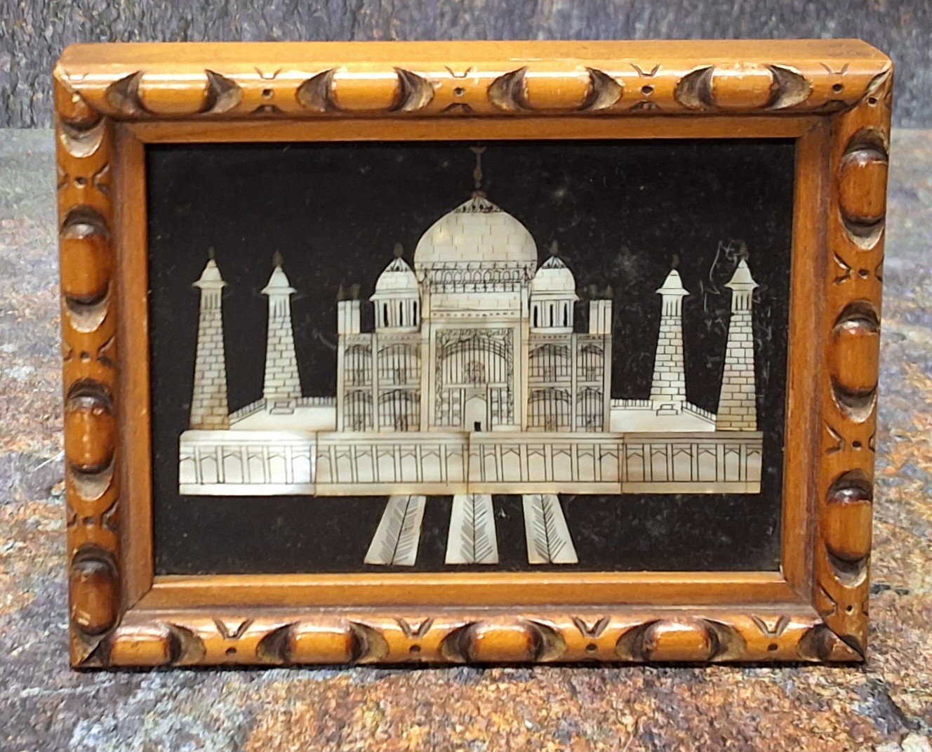 A 19th century Indian stoneware Pietra-dura panel, inlaid with a mother of pearl with the Taj-Mahal,