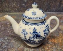 A Lowestoft teapot and cover,  painted in underglazed blue with pagoda and fence, ball finial, 12.