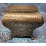 A late 19th century pewter bombe tea caddy,  engraved with foliate scrolls within a basket weave