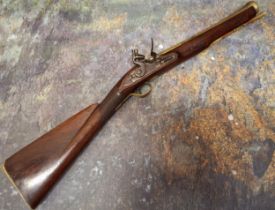 An 18th century flintlock blunderbuss, marked L.C.M. , 35.5cm long brass cannon barrel, bell