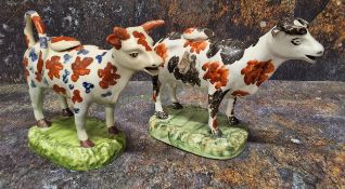 A North of England cow creamer, standing four square, with black and rust stylised patch markings,