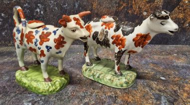 A North of England cow creamer, standing four square, with black and rust stylised patch markings,