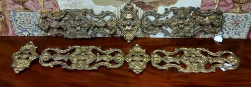 A pair of 19th century French embossed gilt sheet-metal appliqués/bell pulls, 90cm long