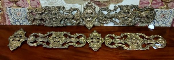 A pair of 19th century French embossed gilt sheet-metal appliqués/bell pulls, 90cm long