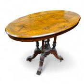 A Victorian walnut and satinwood inlaid oval side table, 67cm high, 88cm wide, c.1870