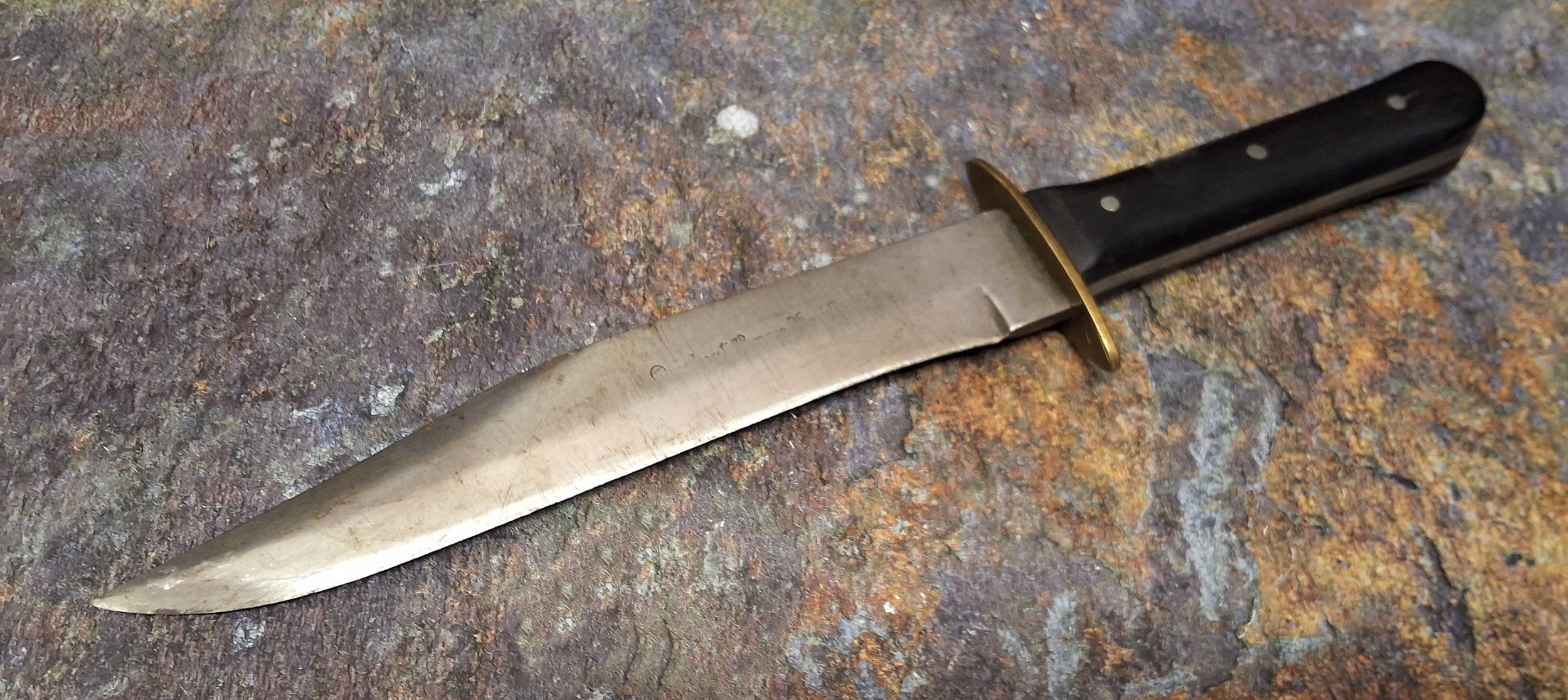 A 19th century bowie knife, with American black walnut grip, the blade inscribed Original Bowie