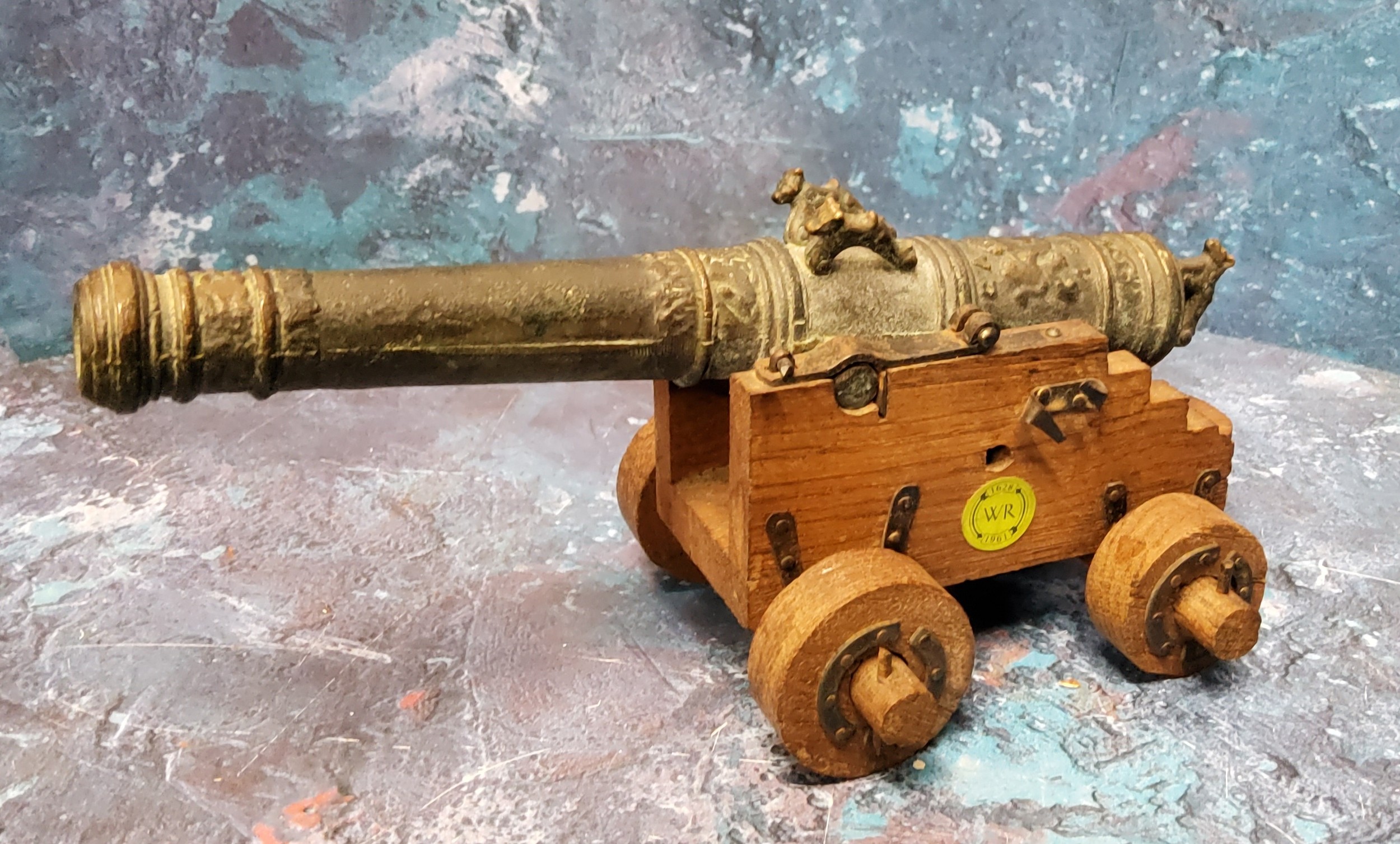 An 20th century bronze replica of Vasa Wasa Sweden 1628  ship's cannon, on oak four wheel