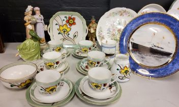 A Noritake tea service, for six, decorated with stylised flowers, printed mark;  a Royal Doulton