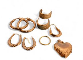 A 9ct gold heart shaped locket, 1.85g; a 9ct gold hoop earrings; 1.31g; another two pairs, 1.7g;