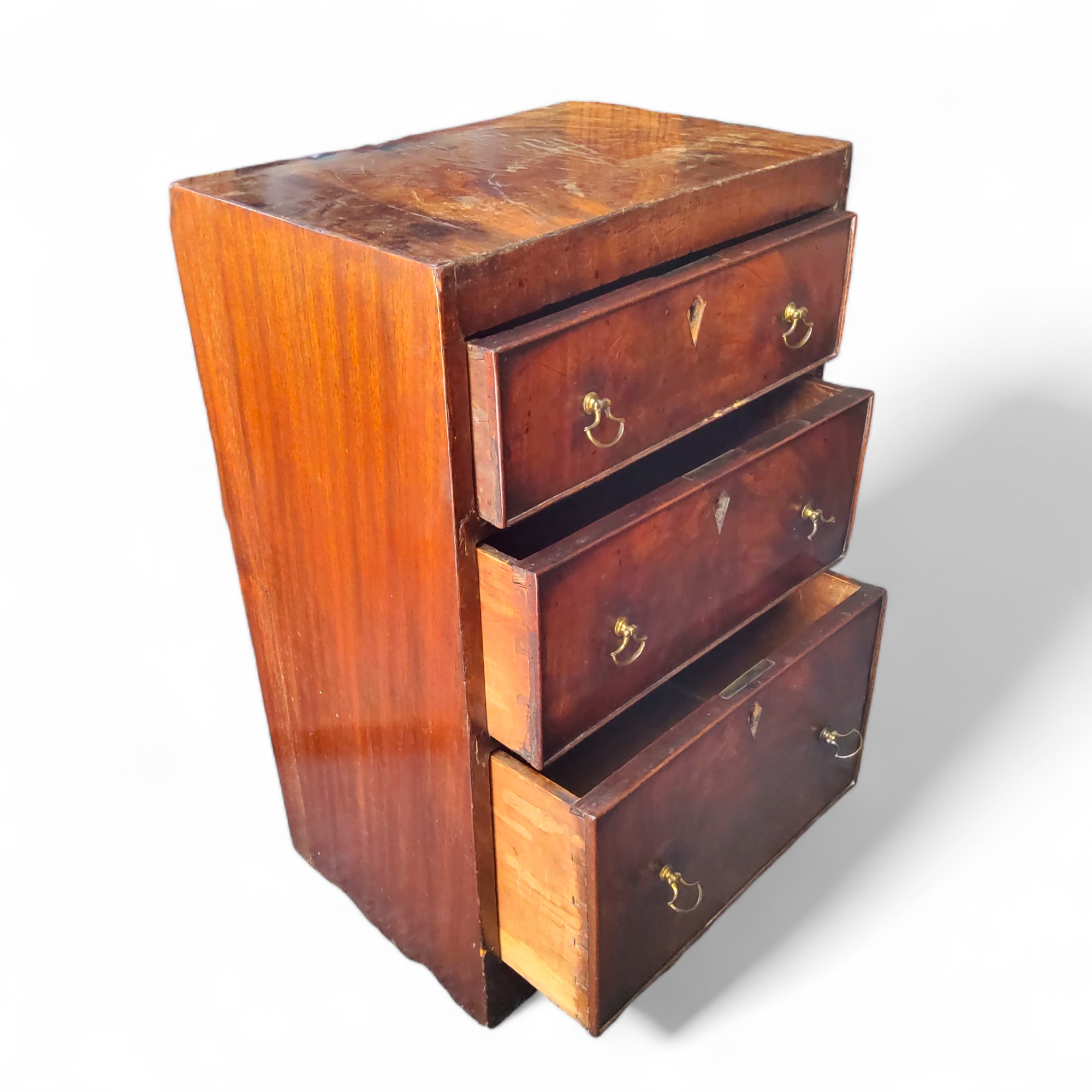 A small George III flamed mahogany chest of three graduated cockbeaded drawers, lozenges removed, - Image 2 of 3