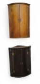 A George III oak bow fronted corner cabinet, H-hinges, 97cm high, 87cm wide; another (2) c.1790