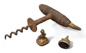 A 19th century corkscrew, turned handle, with brush, 14cm long;  a 19th century gilt metal  seal;