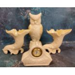 A Belleek Owl vase, lustrous yellow wings, 21.5cm high, green mark;  a pair of similar cornucopia