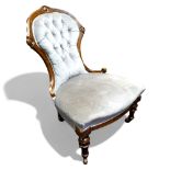 A Victorian walnut nursing chair, c.1860