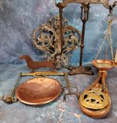 A set of cast iron and copper balance scales;   a set of brass and wrought iron balance scales
