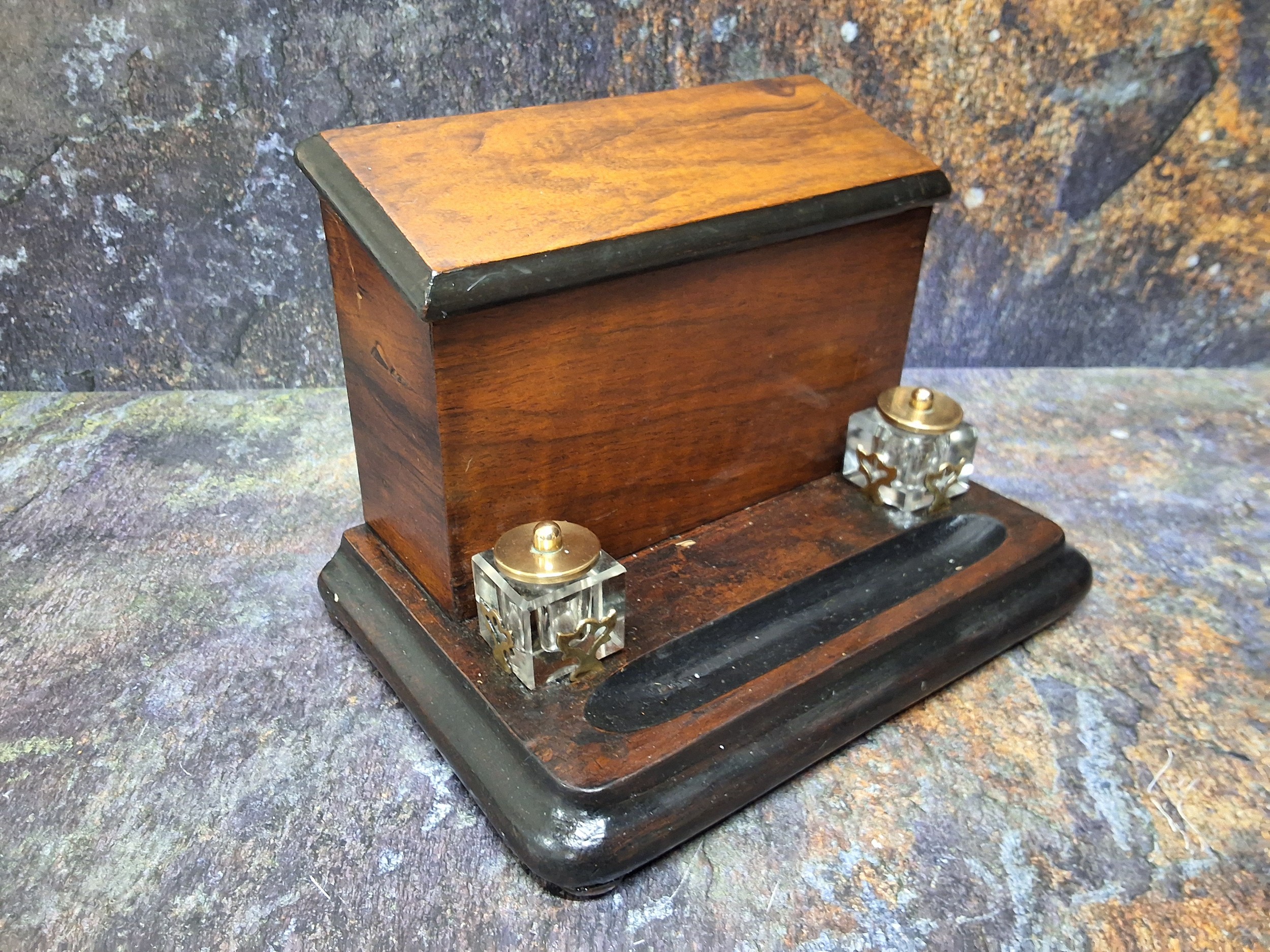 A Victorian walnut and ebonised stationery box, hinged slope cover, the interior with letter