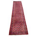 A 19th century Afghan runner, 335cm x 76cm