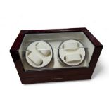 A Floureon high gloss lacquered wood and clear perspex quad watch winder,  complete with adapter