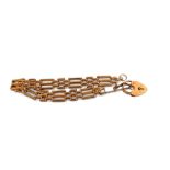 A 9ct gold three bar gate bracelet, safety chain, heart shaped padlock, 16.33g