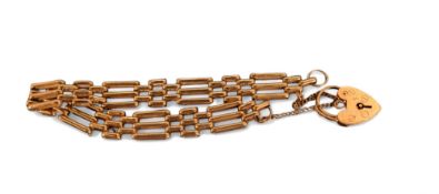 A 9ct gold three bar gate bracelet, safety chain, heart shaped padlock, 16.33g
