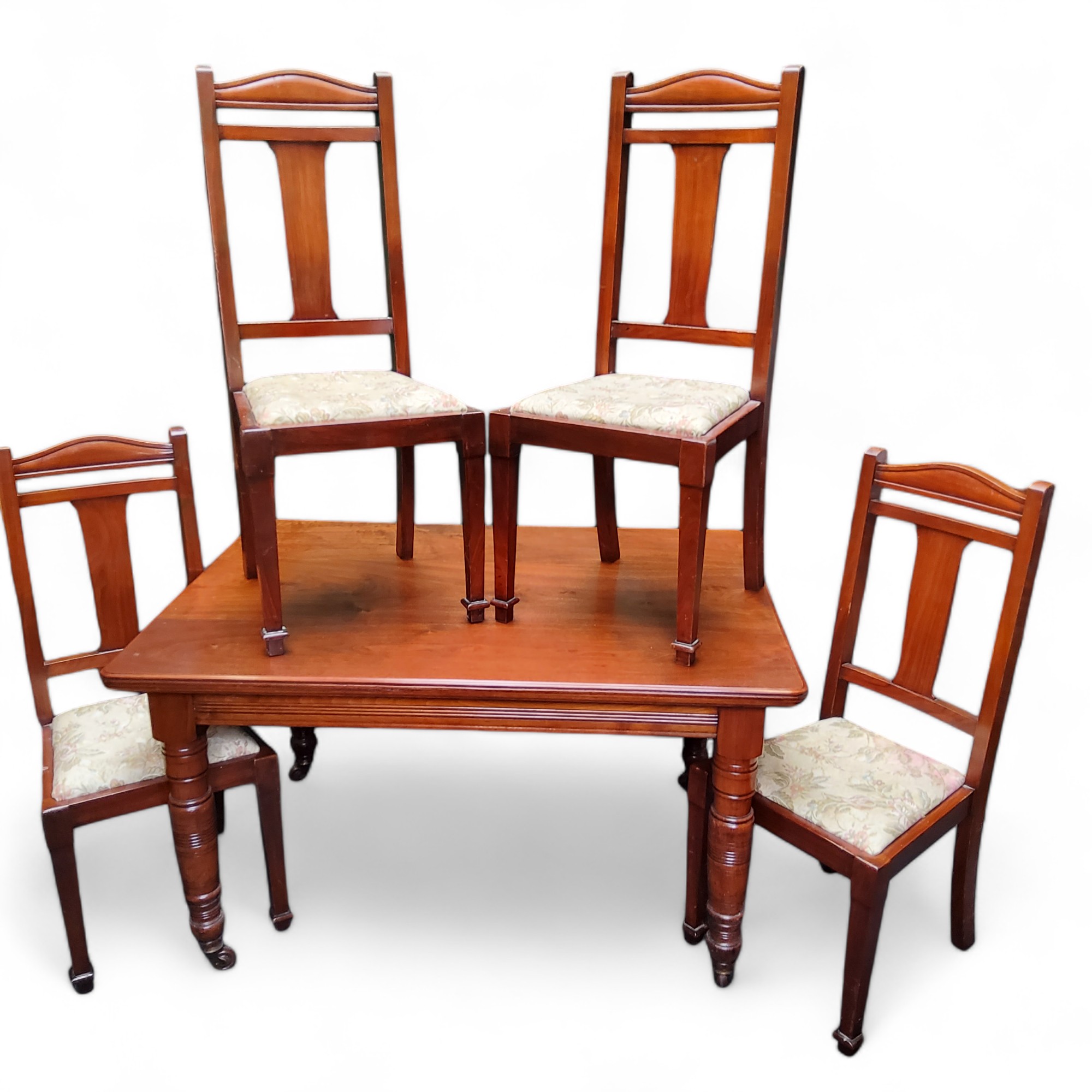 A set of four mahogany dining chairs, drop-in seats; a Victorian dining table (5)