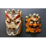 An Indian  wooden wall mask of Mahakal Bhairab, 32cm high;  another, dance mask (2)