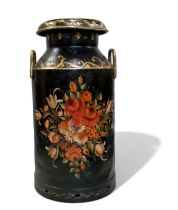 A large early 20th century ebonised bargeware milk churn, painted with floral swags, picked out in