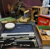 A Harling London draughtman's set, cased;  a Students Microscope;  an Eskimo fan;  Boots Improved
