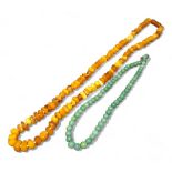 A jade bead necklace; an amber necklace, 36g