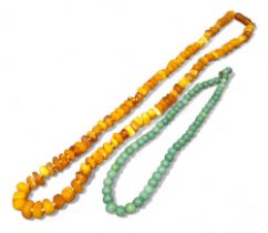 A jade bead necklace; an amber necklace, 36g