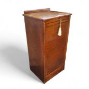 A 20th century oak tambour fronted side cabinet, the interior fitted with nine drawers, made by