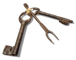 A 17th century cast iron key, 11.5cm long;  another;  a small fork (3)