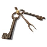 A 17th century cast iron key, 11.5cm long;  another;  a small fork (3)