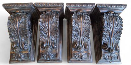 A set of four 'bronzed' resin wall brackets, moulded with anthemions and leafy scrolls, egg-and-dart