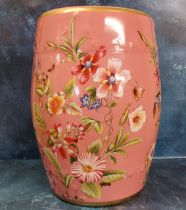 A contemporary Chinese conservatory barrel seat, decorated with flowers and foliage,  on a vivid