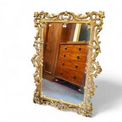 A large Florentine style gilt mirror, 124cm high, 85cm wide