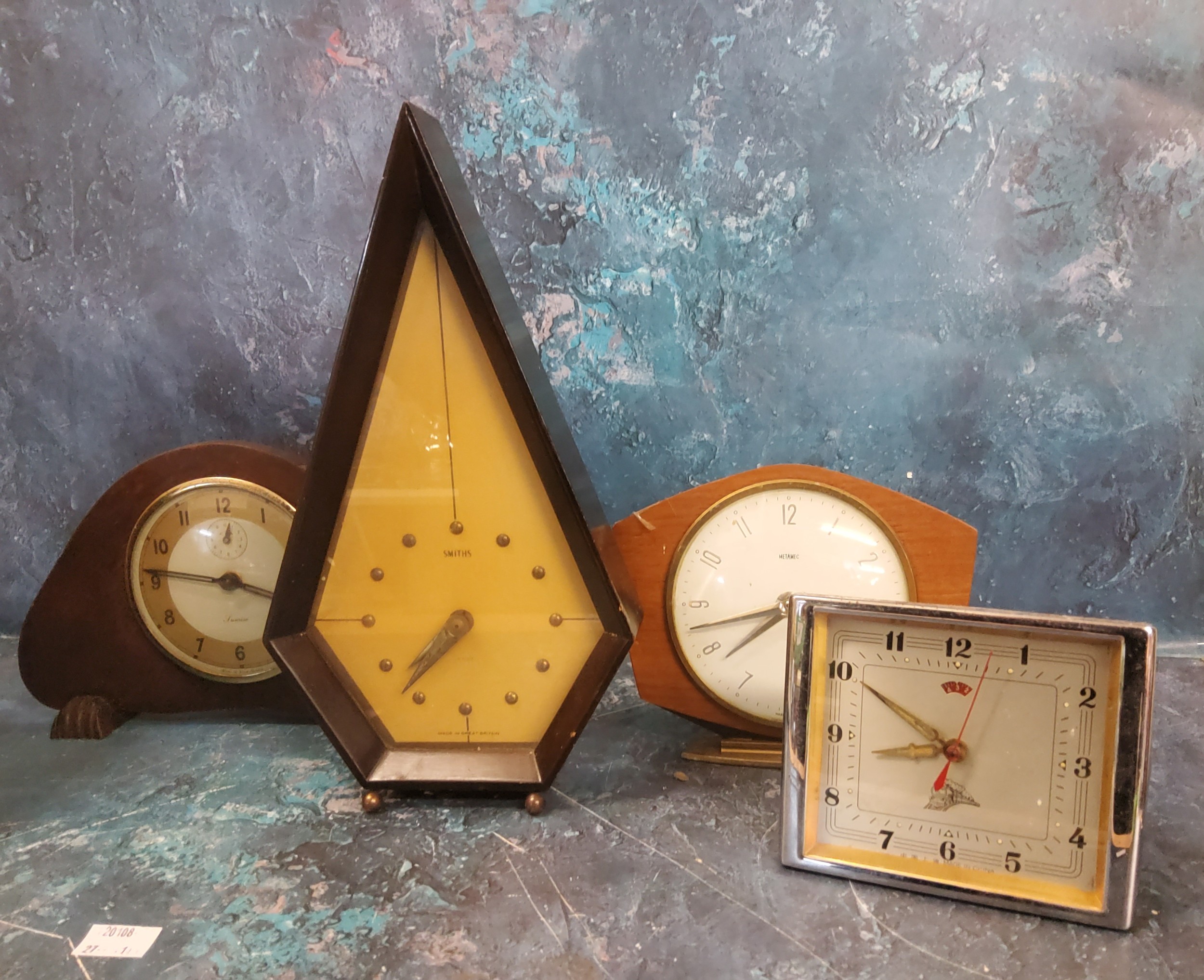 An Art Deco mantel clock, by Smiths, pointed hexagonal case, ball feet, 30cm high, c.1930;