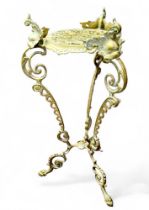 An early 20th century pierced brass jardinere stand, 62cm high