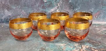 A set of six Mosers pink flashed glass tumblers,  gilt band with scrolling foliage, etched mark